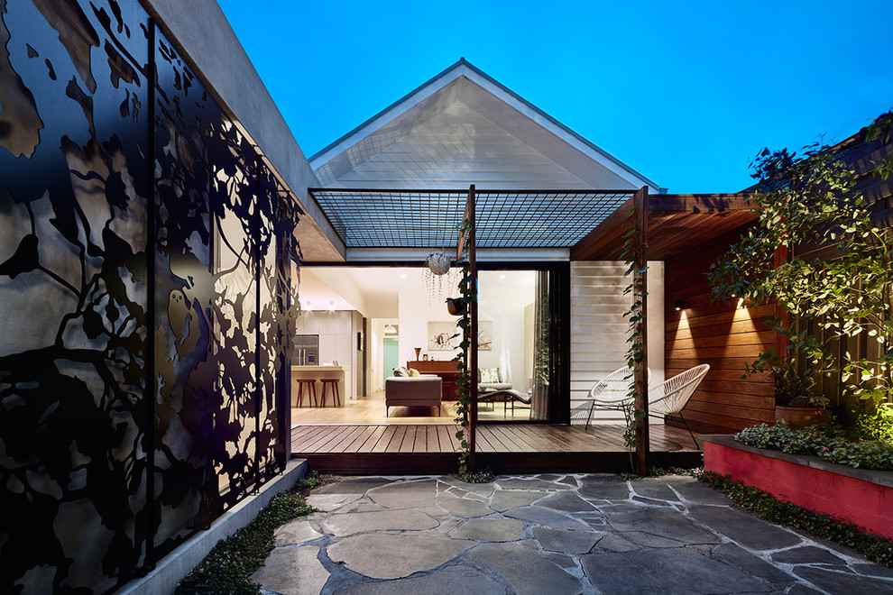Design ideas for a contemporary back patio in Melbourne with decking and a pergola.