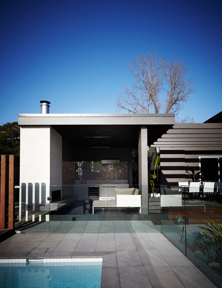 Inspiration for a contemporary patio remodel in Melbourne with a fire pit and a pergola
