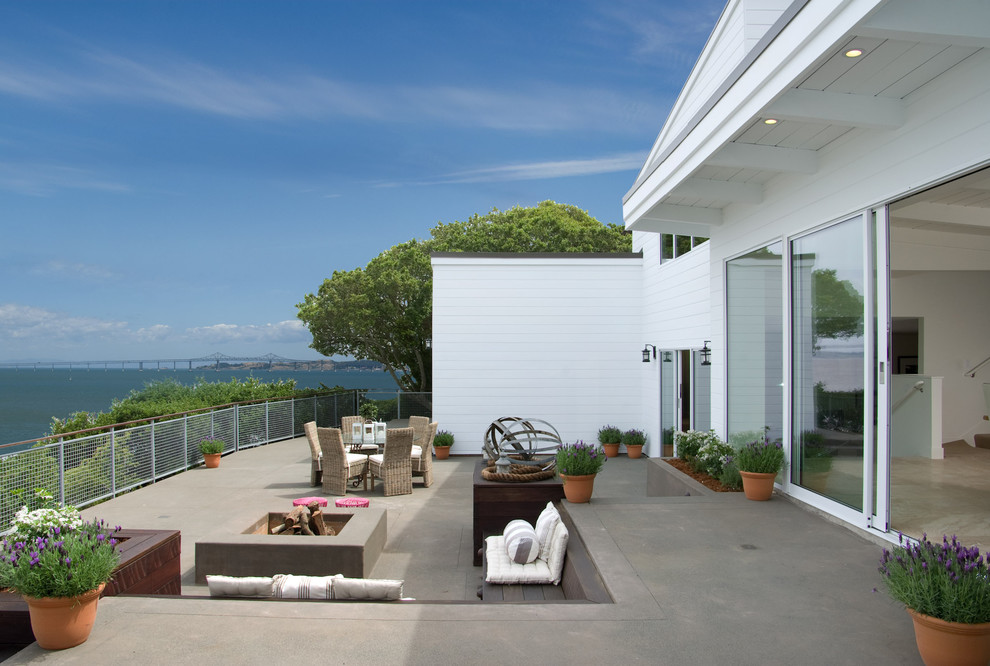 Photo of a contemporary patio in San Francisco with a fire feature.