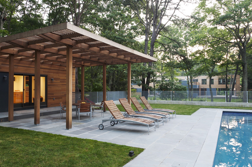 Contemporary patio in New York with a pergola.