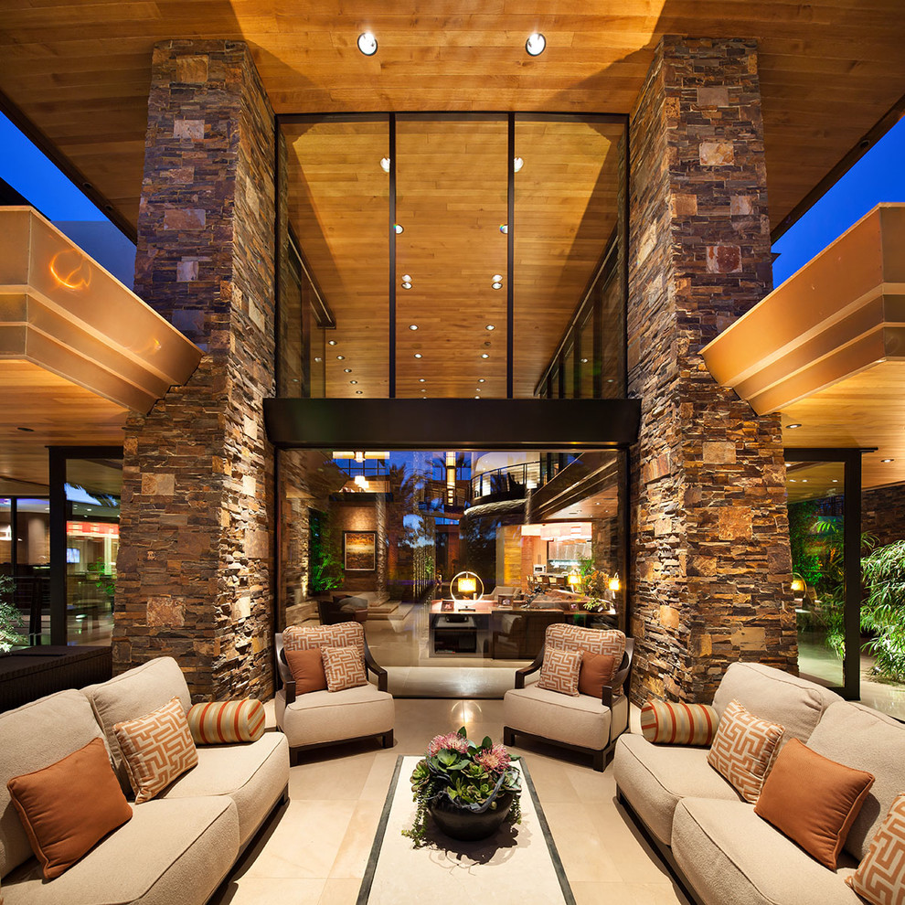 Design ideas for a contemporary patio in Las Vegas with a roof extension.