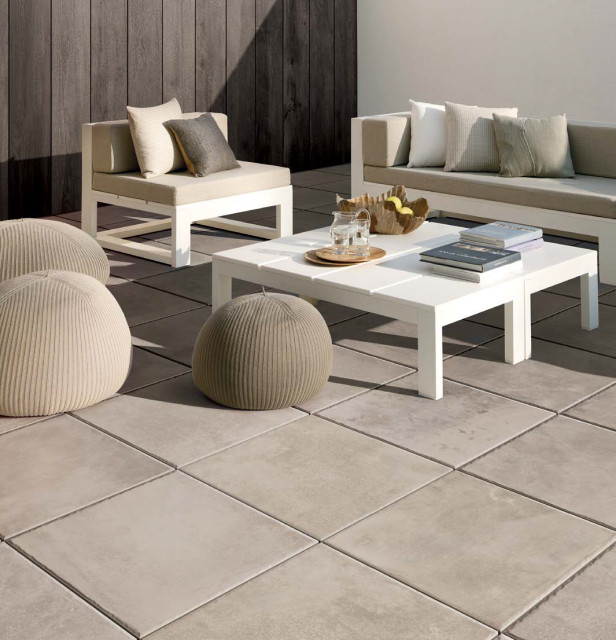 Contemporary patio with grey stone look porcelain tile floors