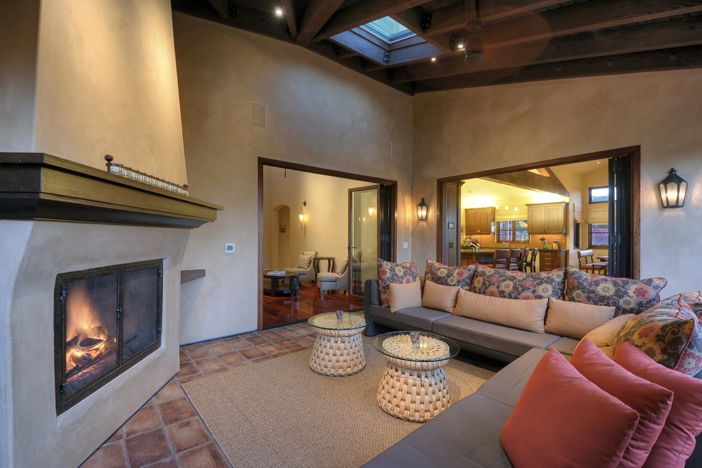 Example of a large southwest patio design in San Francisco with a roof extension