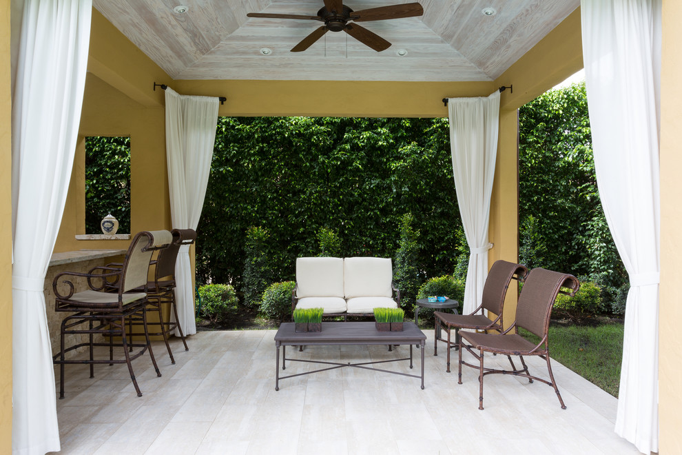 Example of a tuscan patio design in Miami
