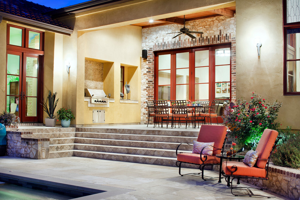 Design ideas for a mediterranean patio in Austin with a roof extension and a bbq area.