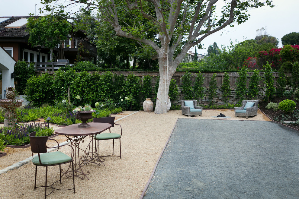 Example of a large classic backyard patio design in Orange County with no cover