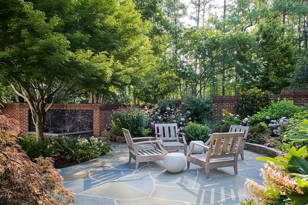 Inspiration for a classic patio in Raleigh with a water feature.