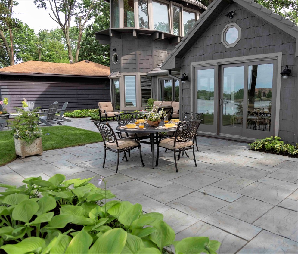 Inspiration for a mid-sized craftsman backyard concrete paver patio remodel in Chicago with a fire pit and no cover