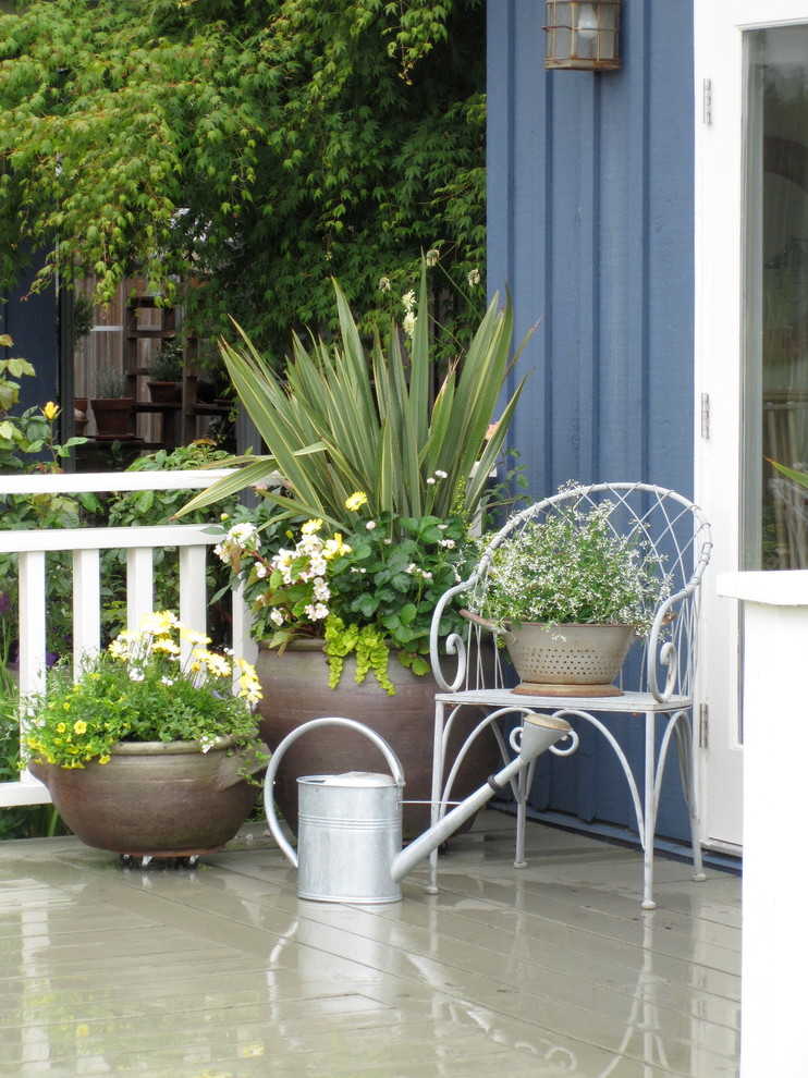 Inspiration for a timeless patio remodel in Vancouver with decking