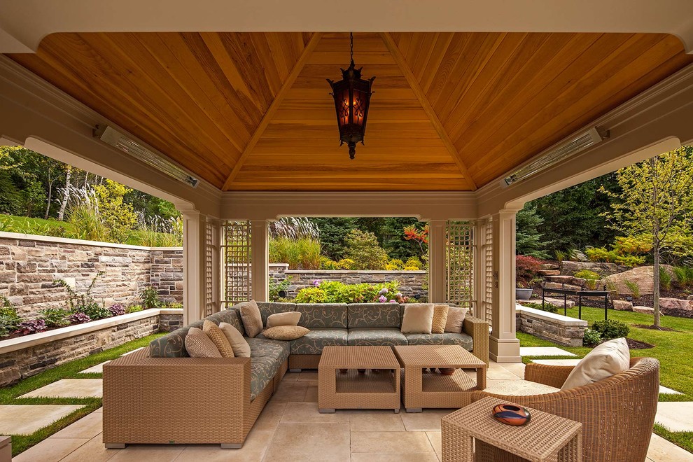 Photo of a traditional patio in Toronto with a roof extension.