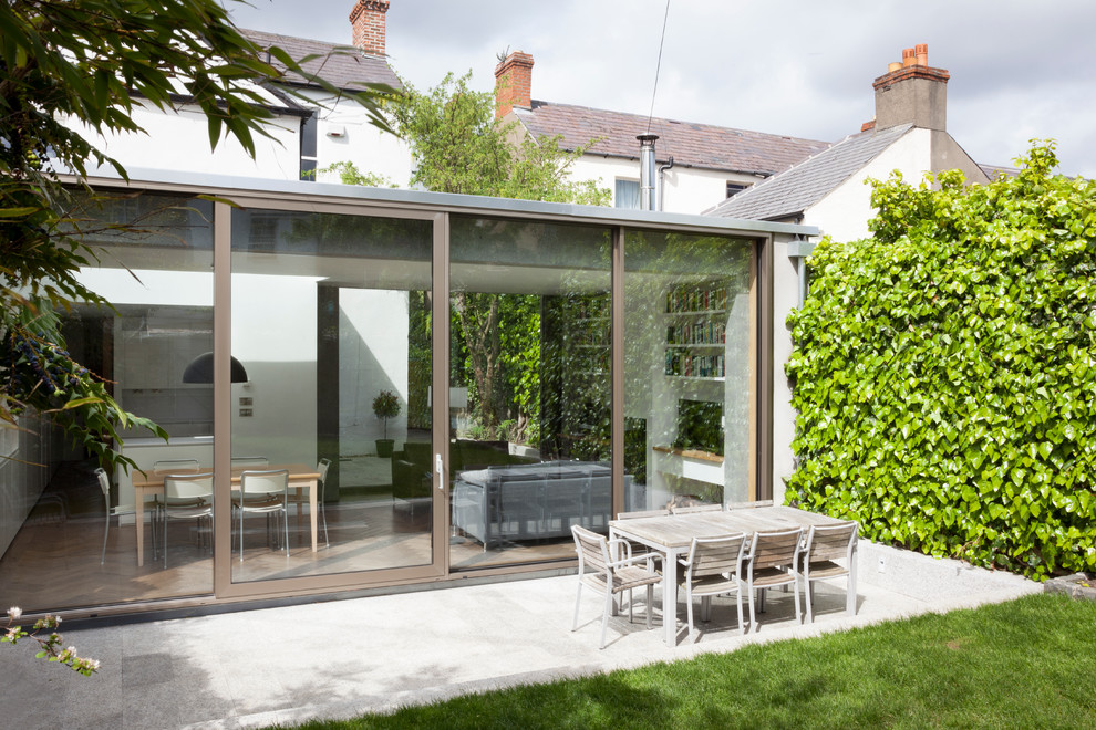 This is an example of a contemporary patio in Dublin.