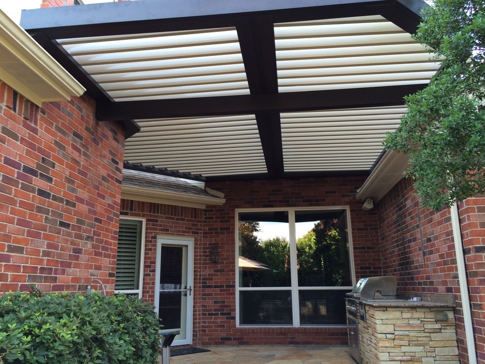 Inspiration for a medium sized traditional front patio in Dallas with tiled flooring and a pergola.