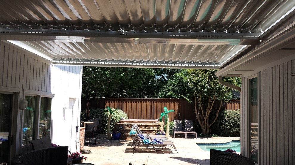 Patio - mid-sized traditional backyard tile patio idea in Dallas with a pergola