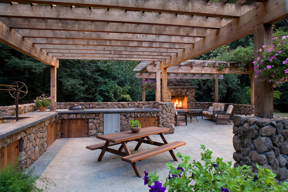 Inspiration for a rustic patio in San Francisco with a fire feature and a pergola.