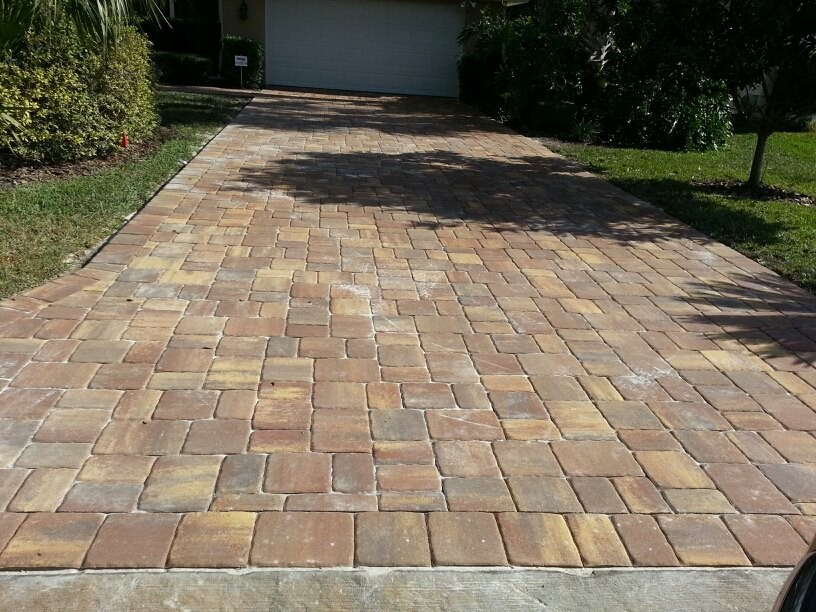 Photo of a small mediterranean front patio in Orlando with concrete paving and no cover.