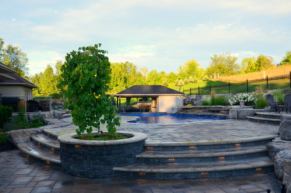 Curvaceous Pool and multi level patio Beach Style Patio Toronto by Melanie Rekola