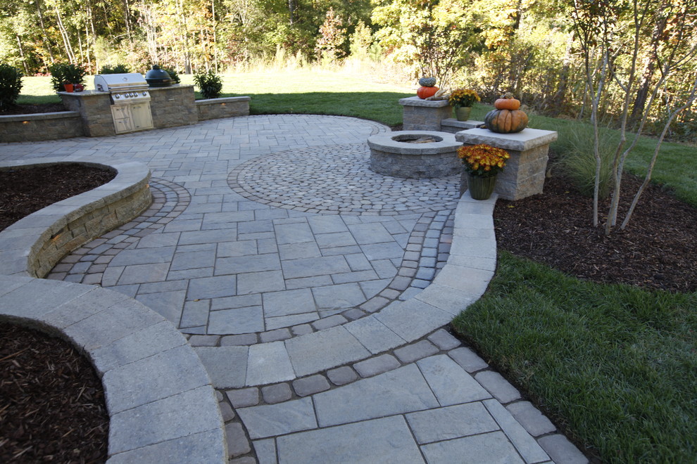 Design ideas for a large traditional back patio in Richmond with a fire feature, concrete paving and no cover.