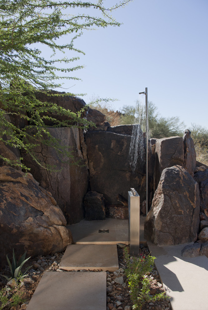 Inspiration for a southwestern backyard concrete paver outdoor patio shower remodel in Phoenix