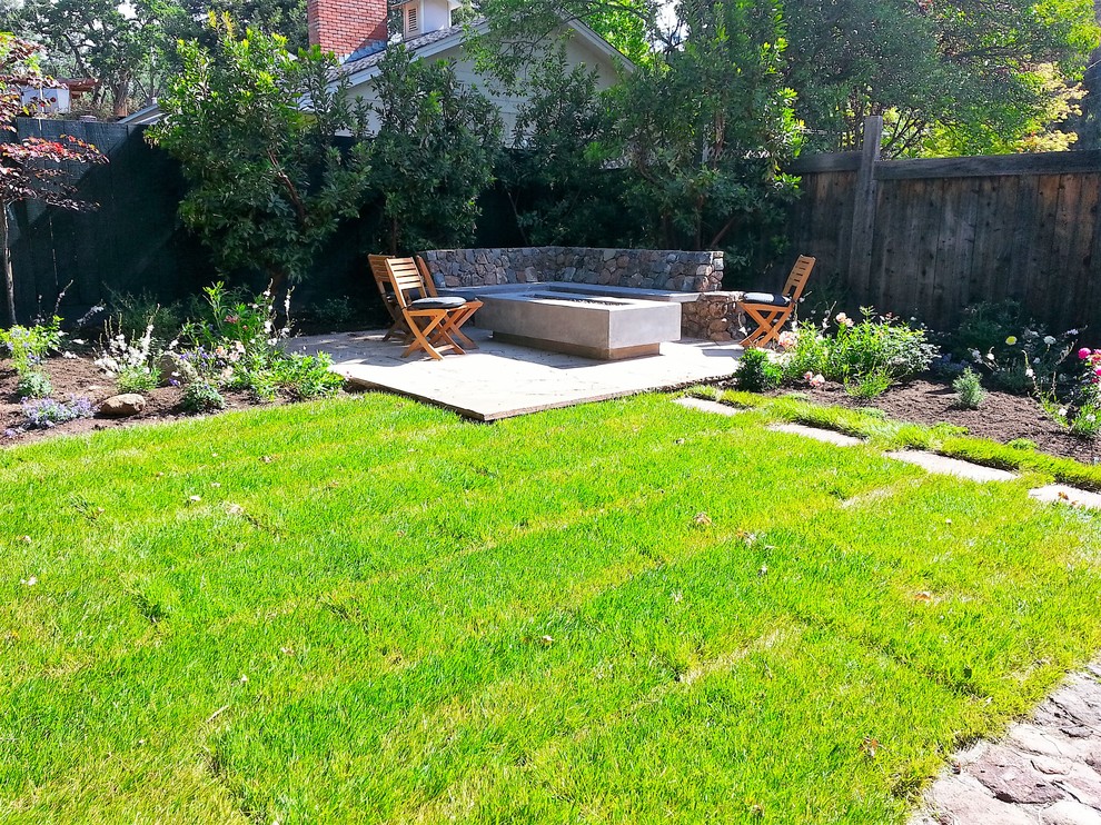 Example of a small arts and crafts backyard stone patio design in San Francisco with a fire pit and no cover
