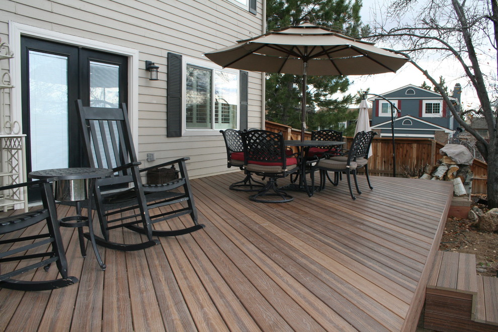 Small transitional backyard patio photo in Denver with decking and no cover