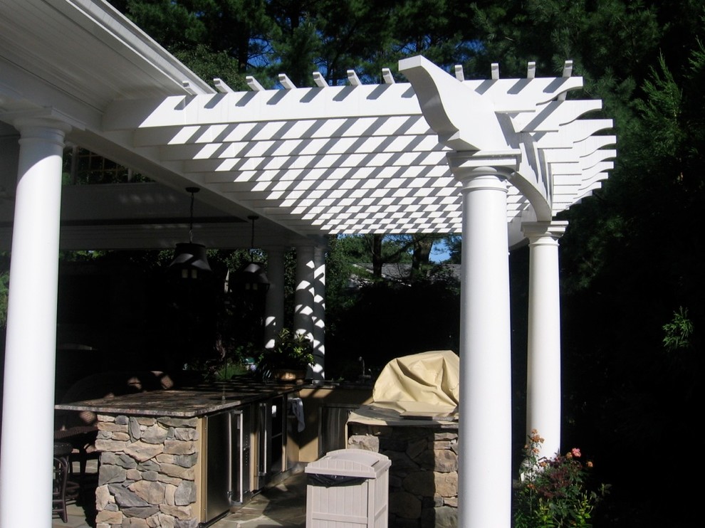 Photo of a traditional back patio in New York with decking and a gazebo.