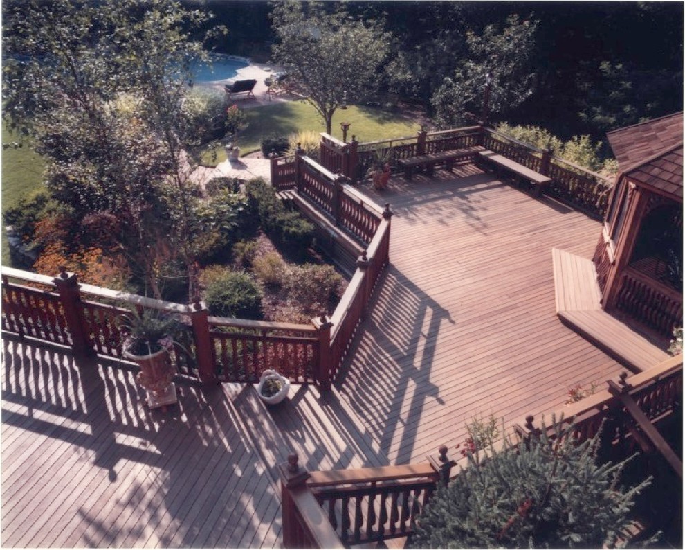 Example of a classic backyard patio design in New York with decking and a gazebo