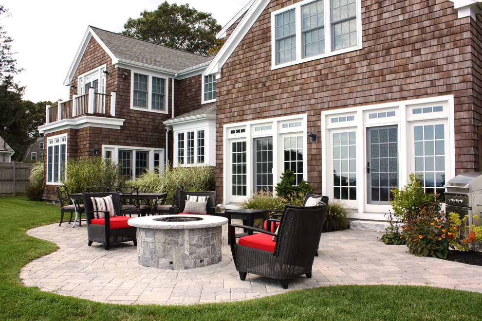 Patio - coastal backyard patio idea in Boston with a fire pit