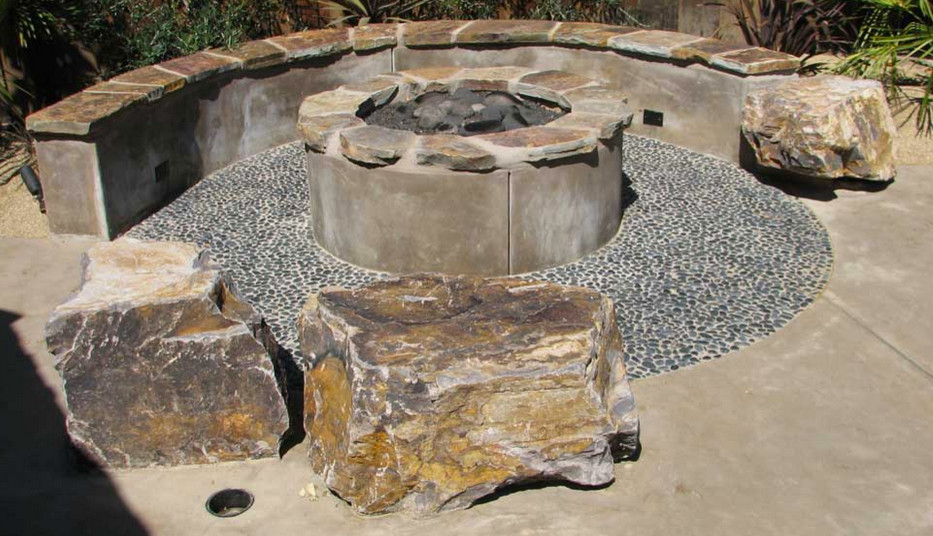 Example of a mid-sized arts and crafts backyard concrete patio design in San Francisco with a fire pit and a gazebo