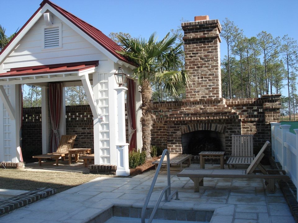 Inspiration for a mid-sized timeless backyard patio remodel in Raleigh with a fire pit and a pergola