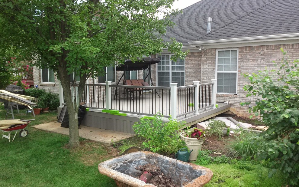 Inspiration for a mid-sized timeless backyard patio remodel in Louisville with decking and no cover