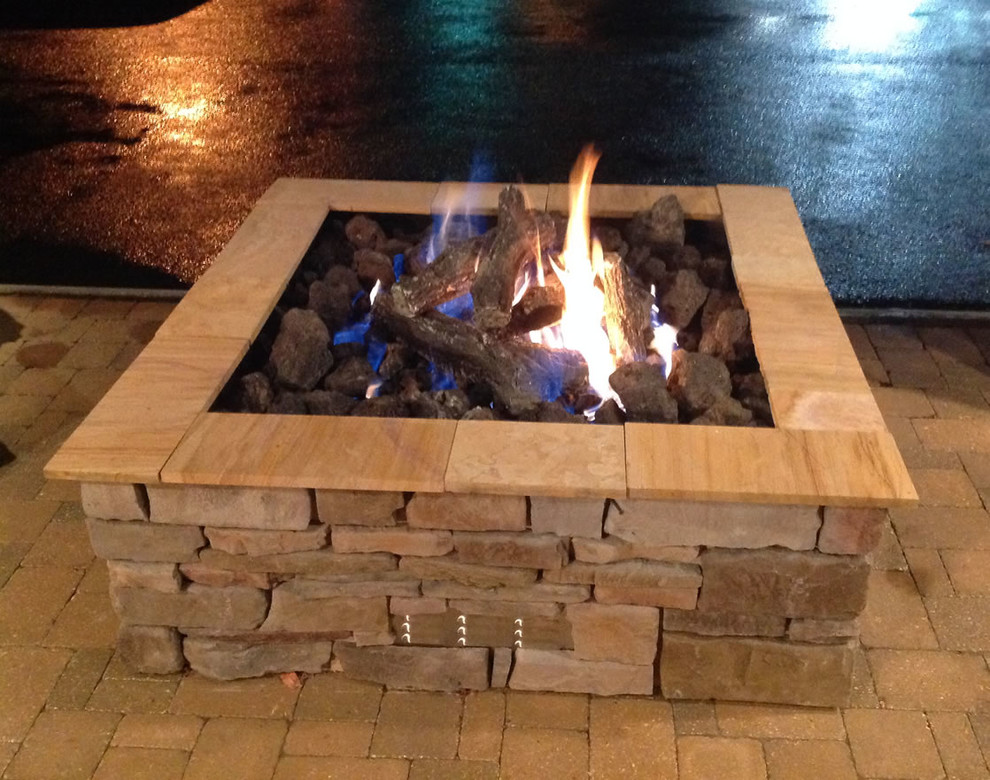 Custom square outdoor gas log fire pit by Fine's Gas Rustic Patio