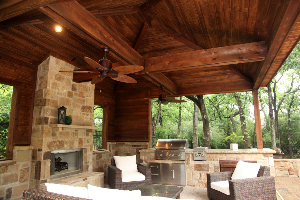 Design ideas for a large classic back patio in Dallas with an outdoor kitchen, concrete slabs and a roof extension.
