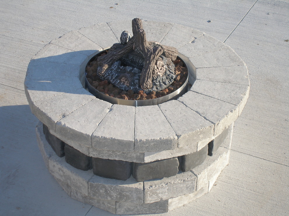 Mid-sized elegant backyard concrete patio photo in Toronto with a fire pit and no cover