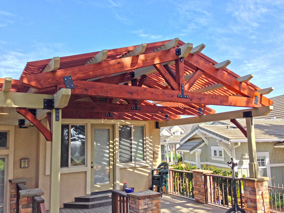This is an example of a medium sized classic back patio in San Luis Obispo with decking and a pergola.