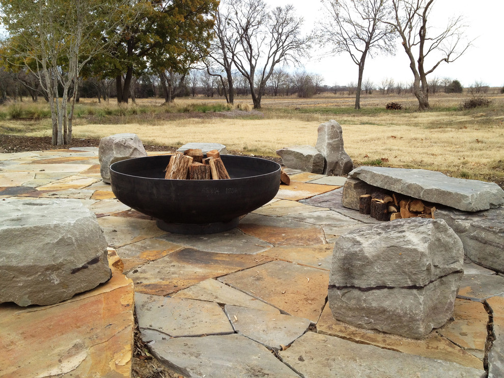 This is an example of a contemporary patio in Dallas with a fire feature.