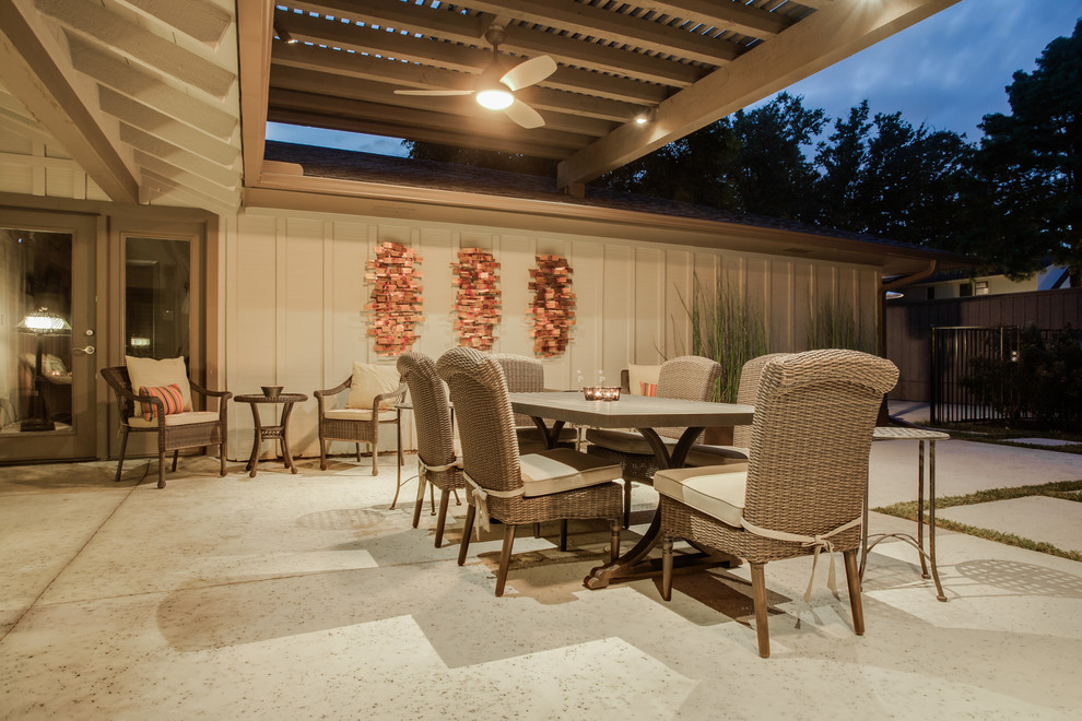 Inspiration for a medium sized rustic back patio in Dallas with an outdoor kitchen, concrete slabs and a pergola.