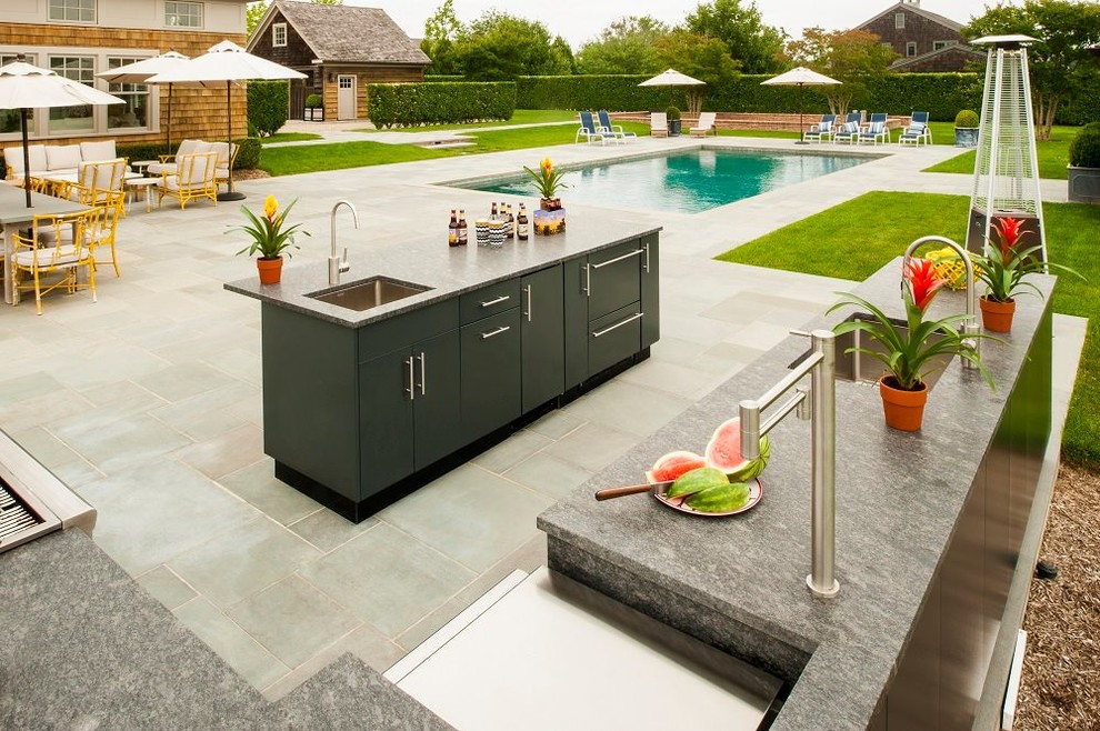 Patio kitchen - huge transitional backyard tile patio kitchen idea in Houston with no cover