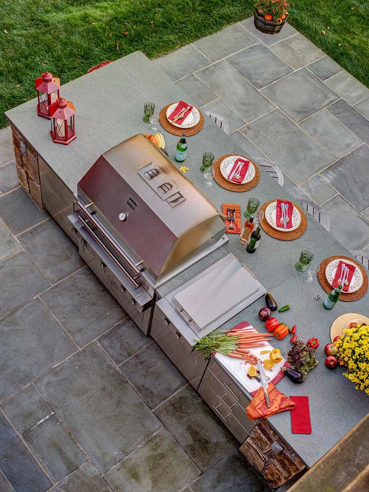 Patio kitchen - mid-sized cottage backyard patio kitchen idea in New York