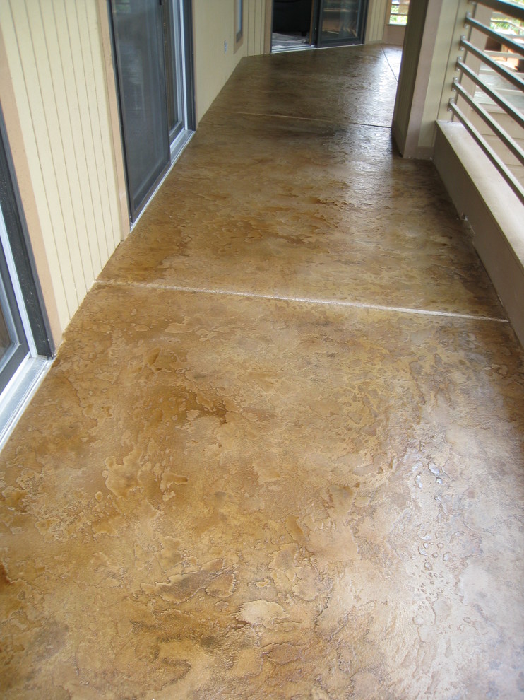 Inspiration for a mid-sized contemporary stamped concrete patio remodel in Other