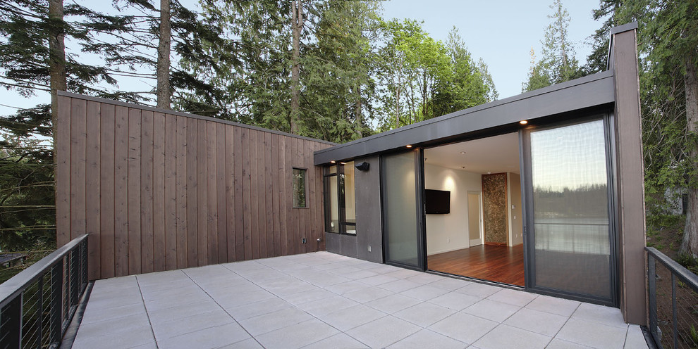 Imagen de patio minimalista de tamaño medio sin cubierta en patio con adoquines de hormigón