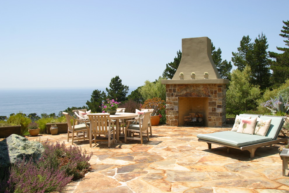 Inspiration for a rustic patio remodel in Seattle with a fire pit