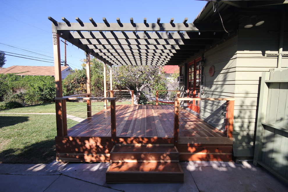 Inspiration for a small modern back patio in Los Angeles with decking and a gazebo.