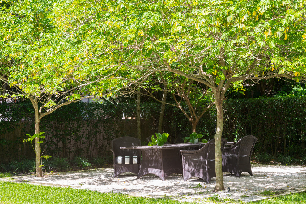 Island style patio photo in Miami with no cover