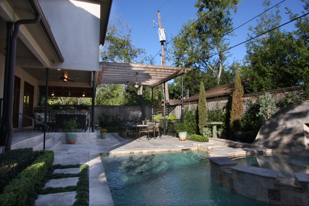 Transitional patio photo in Houston with a pergola