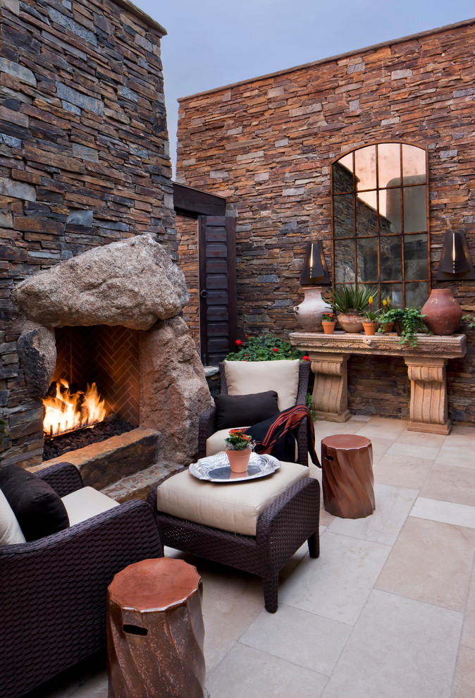 Design ideas for a large contemporary back patio in Phoenix with a fire feature, tiled flooring and no cover.