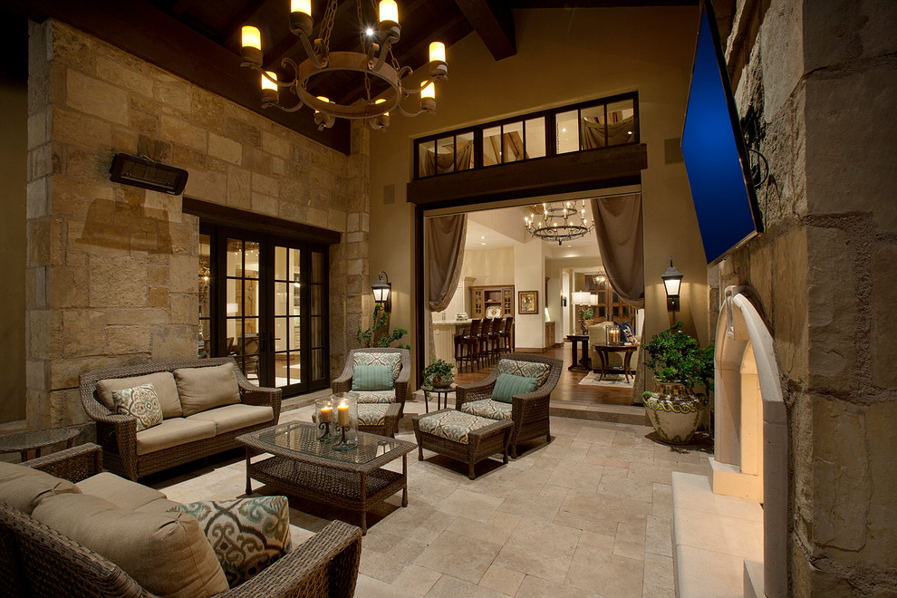 Inspiration for a huge mediterranean side yard stone patio remodel in Phoenix