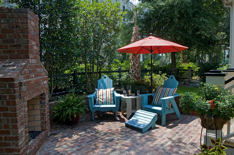 Inspiration for a timeless brick patio remodel in Wilmington with a fire pit