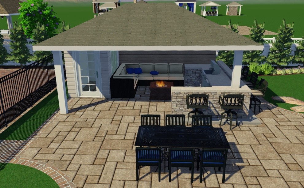 Foto de patio clásico grande en patio trasero con cocina exterior, adoquines de hormigón y cenador
