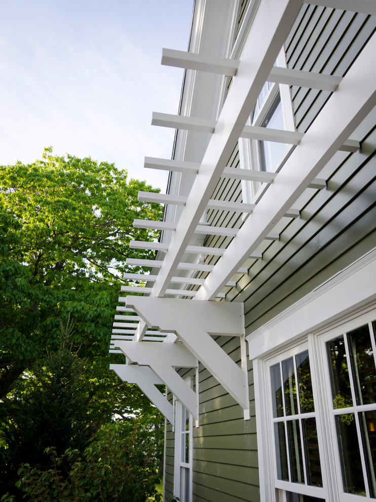 Inspiration for a classic front patio in DC Metro with a pergola.