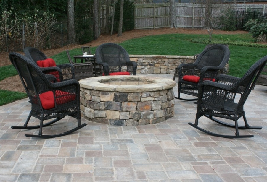 Small traditional back patio in Atlanta with a fire feature, natural stone paving and no cover.